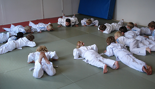Children learning pushups